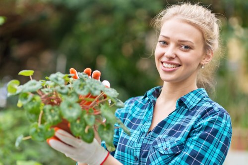 Gardener preparing a garden service agreement with tools nearby